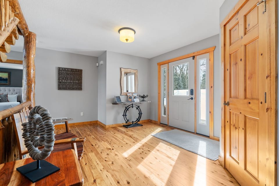 Step into your welcoming entryway where rustic wooden beams and gleaming floors set the tone for your mountain retreat.