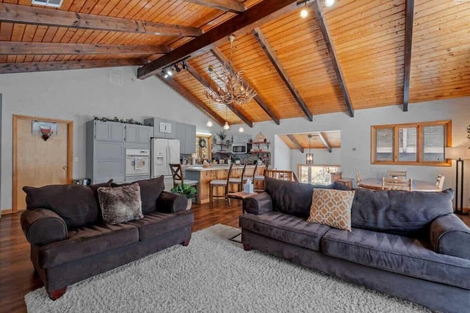 Family comfort meets rustic charm in our Bartlett mountain chalet's open-concept living space