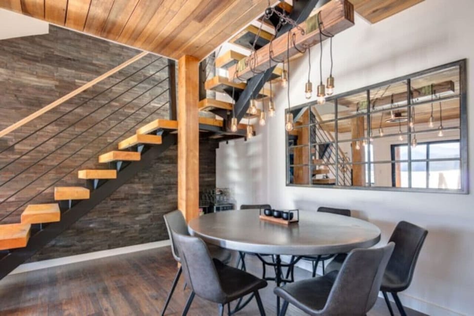 Lower level game/poker table and contemporary floating staircase