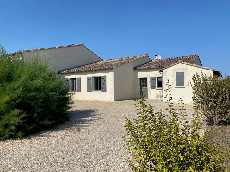 Villa with own parking at the front (garden around the house, not enclosed). 