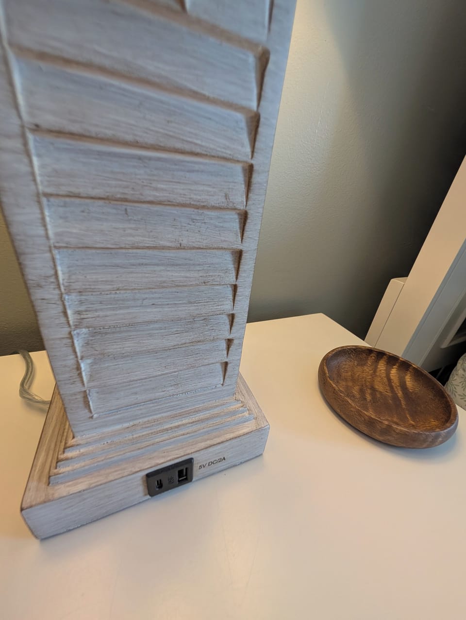 Each bedside lamp is equipped with USB ports for convenient charging. 