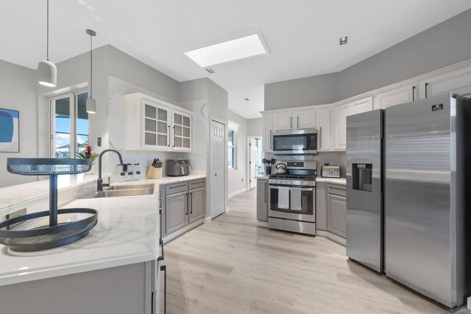 KITCHEN #Quiet #renovated #Stylish #Disney #Parks #kingdom #springs #poolhouse #Vacation #Rental #waterpark #Kissimmee #Orlando #universal #citywalk #legoland #shortstay #longstay #bbq #grill #privatepool