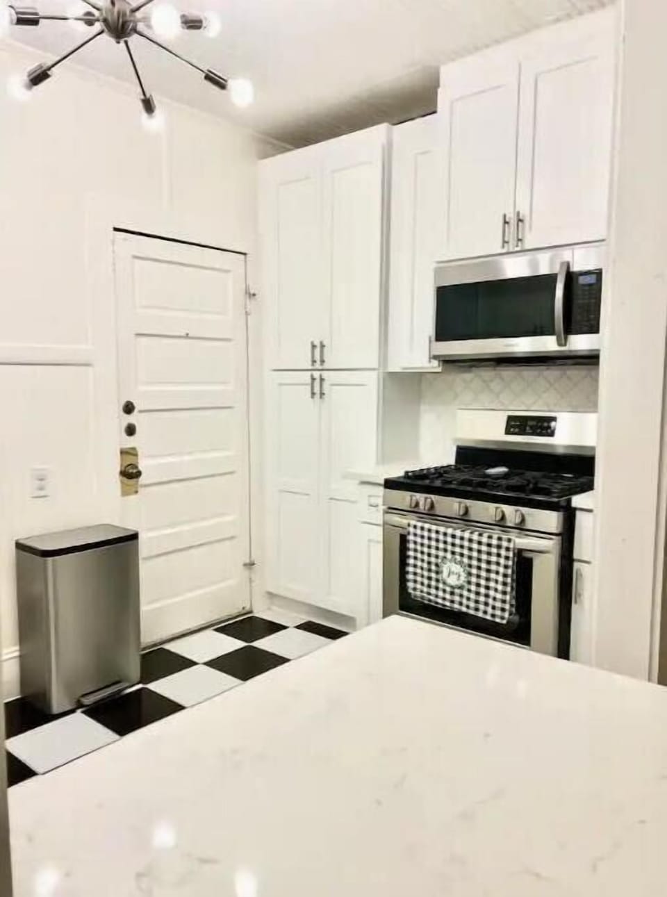 Kitchen includes full-size pantry, stainless steel oven & built-in microwave. 