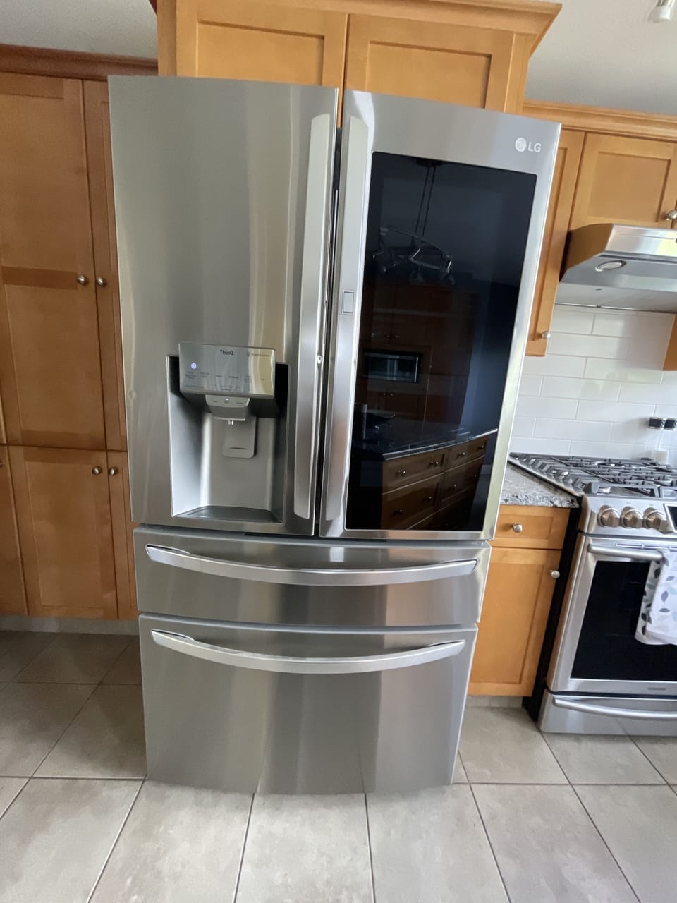 Fridge with ice maker and filtered water. Freezer on bottom.
