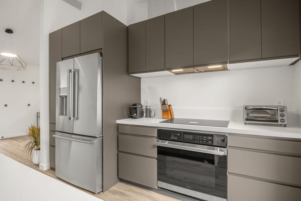 Stunning kitchen with dishwasher, drawer microwave, induction cook top and oven.
