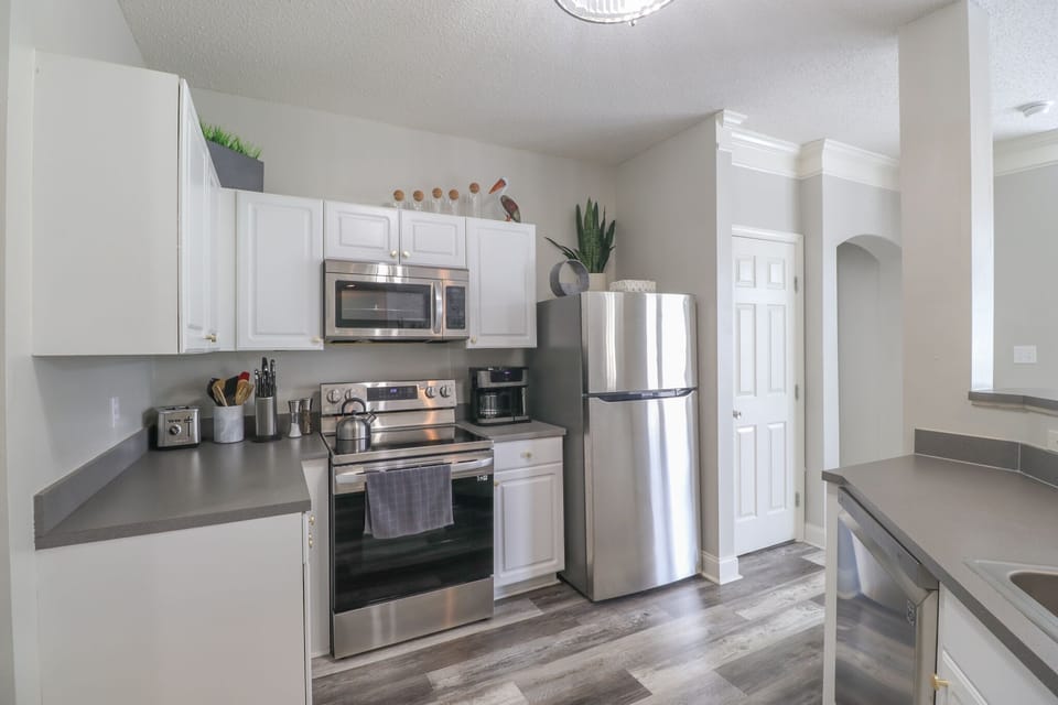 Fully stocked kitchen.  Coffee pot/pod combo, dishwasher, stove, oven, microwave