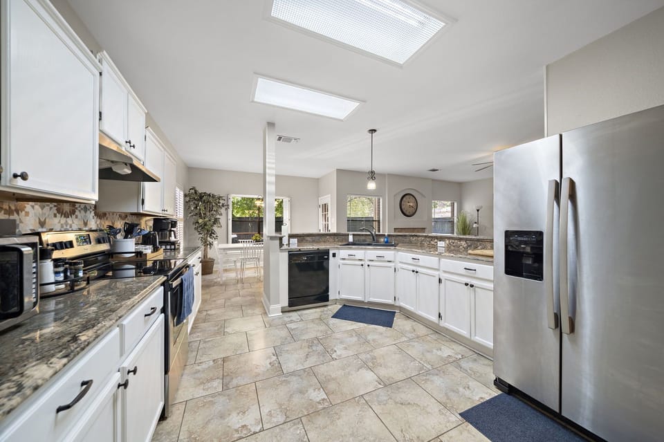 Fridge dispenses water and ice! Stainless steel appliances.