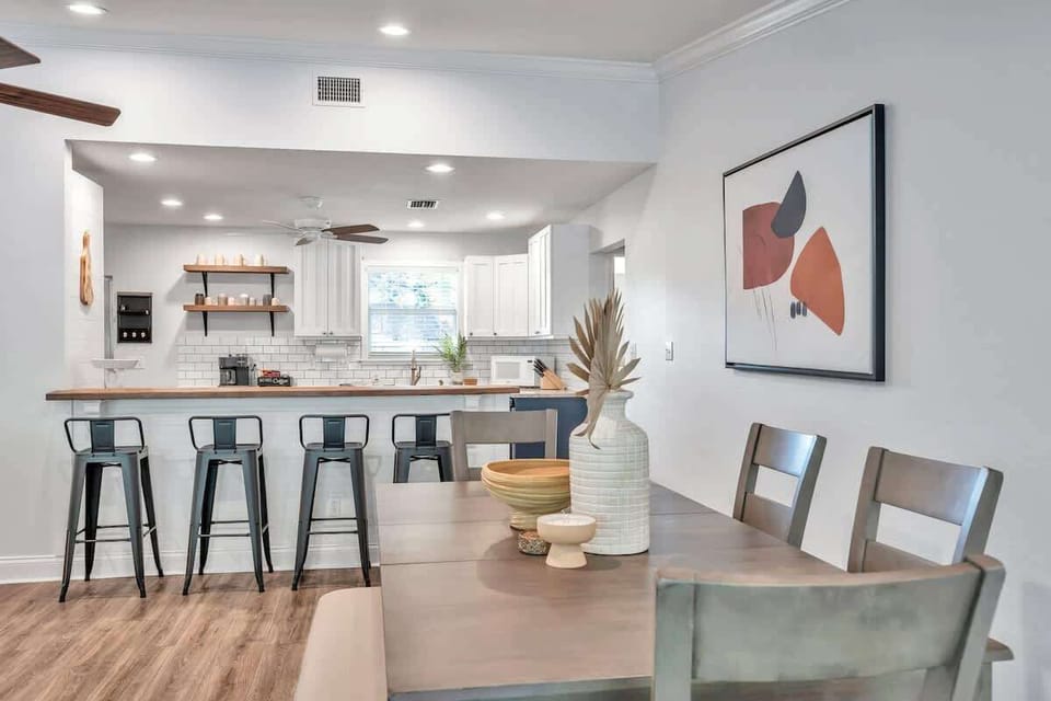 Dining table and kitchen in the back