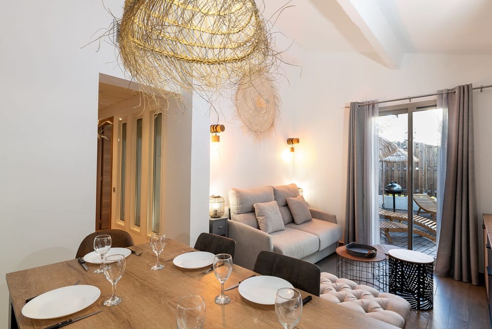 Bed fully prepared with pillows stored inside the sofa compartments for optimal comfort at Mandara Beach by eDwelling, Juan-les-Pins.