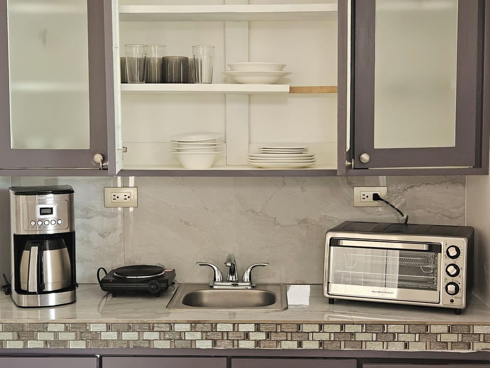 appliances and dishes kitchenette, 
coffee maker, hot plate, toaster oven