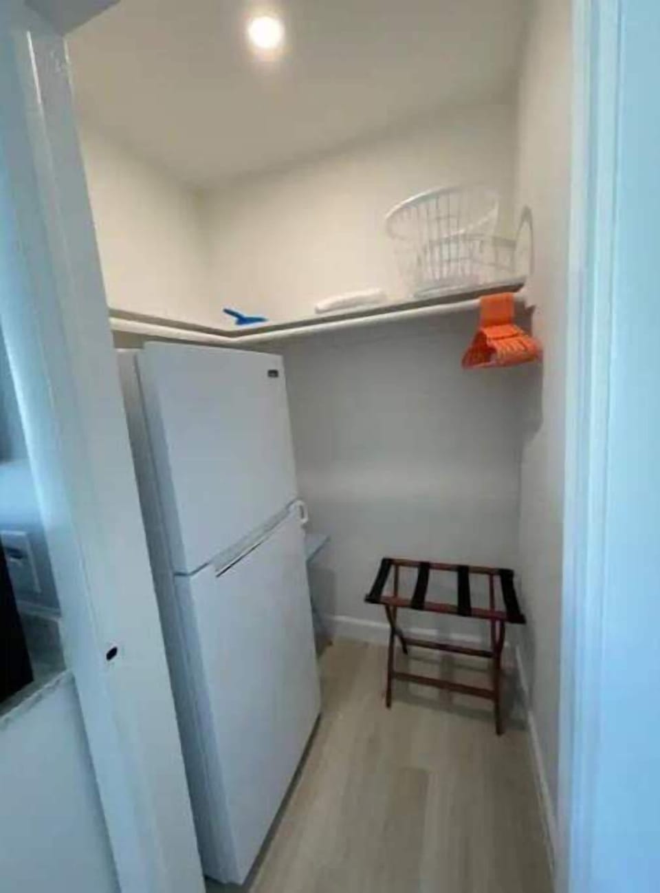 Full refrigerator/freezer and plenty of closet space with hangers. 