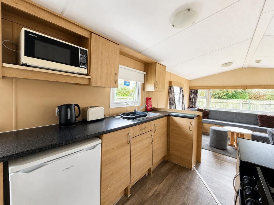 The kitchen &amp; dining area in our static caravan to rent UK is perfect for a relaxing caravan holiday.