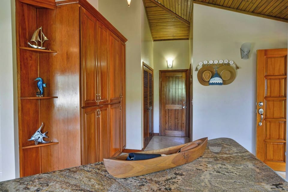 Off the kitchen is the laundry room and third bathroom