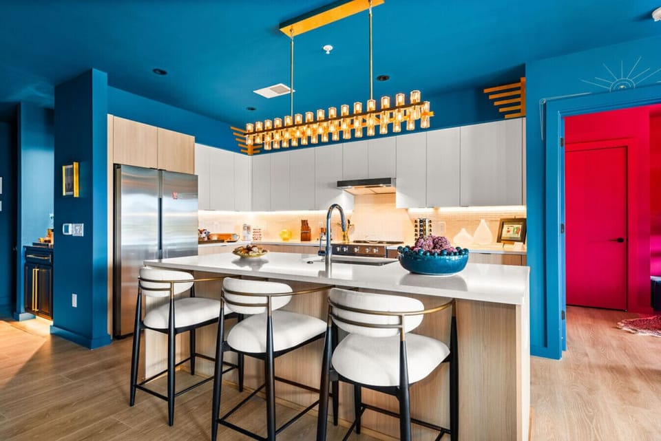 Open kitchen with comfortable bar stools, stocked with all the essentials