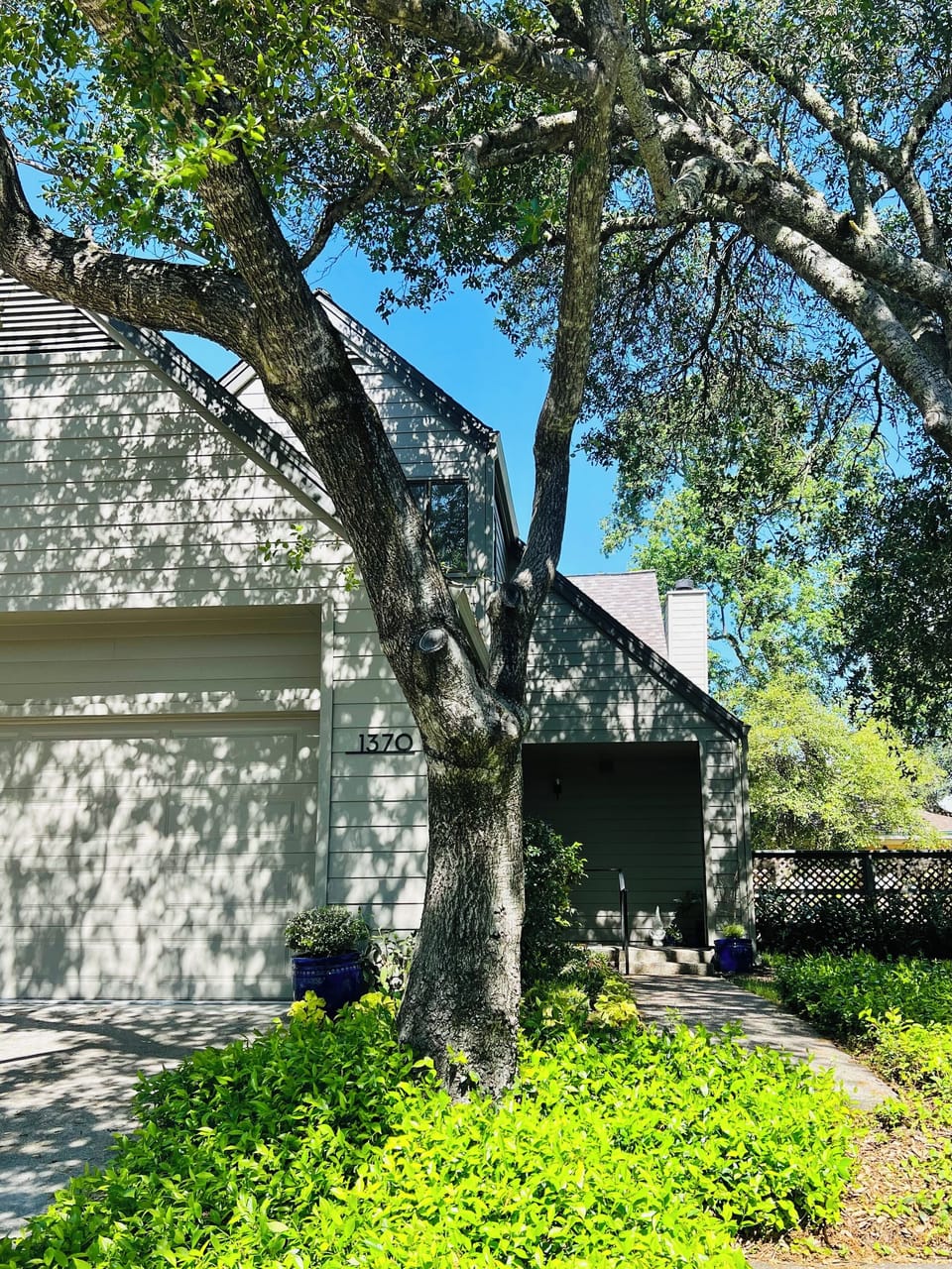 Front of home,  showing attached side by side 2 car garage.
