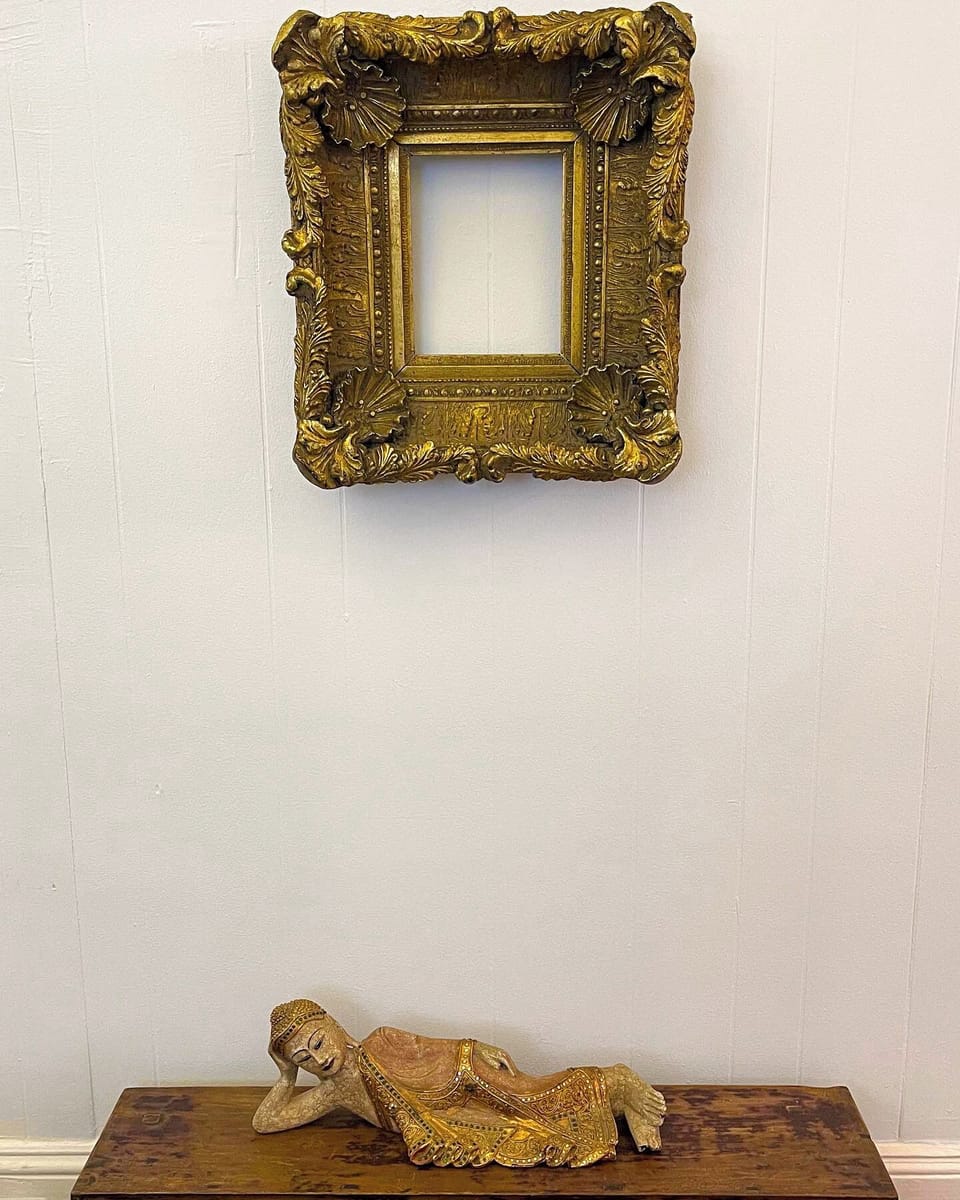 Living Room Wall. Above Antique Frame from old Decore from Fox Theater Atlanta. 