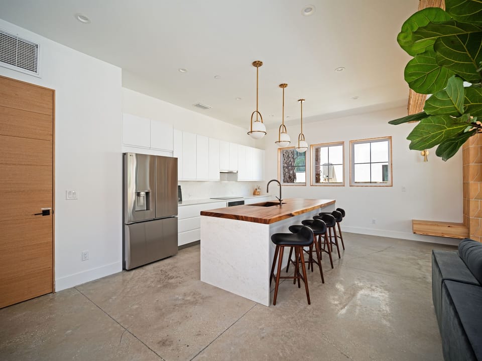 Bright kitchen and breakfast nook designed for long, lingering mornings