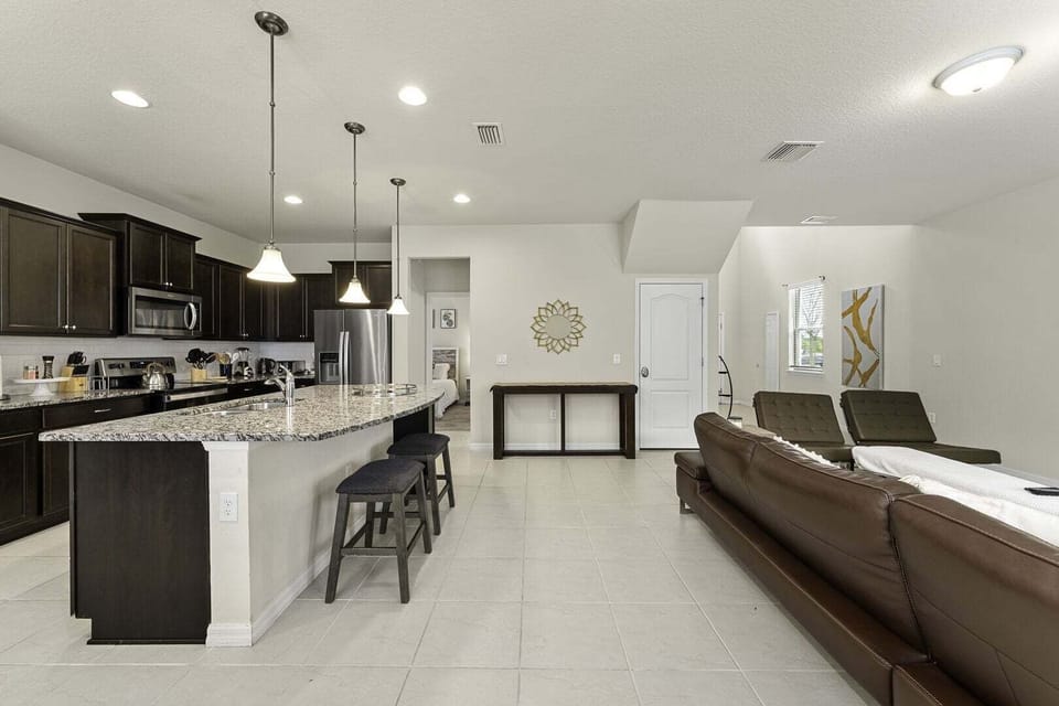 The living room, dining room and kitchen perfectly integrate into one ambience, ideal for socializing during the holidays.