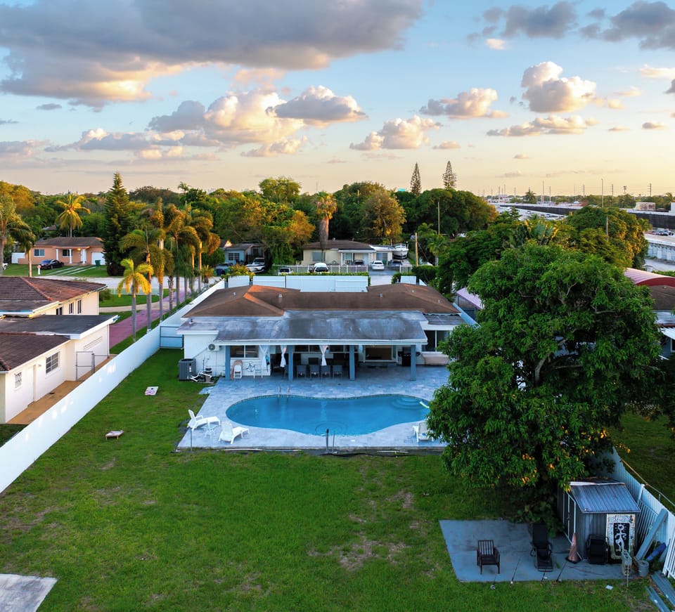 Arial view of large yard, pool and water