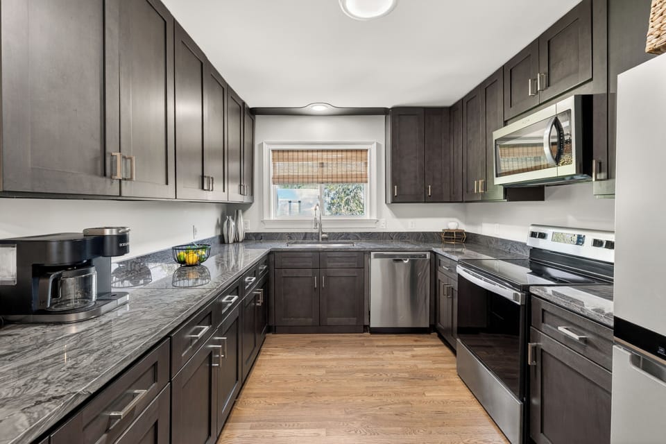 Updated kitchen with stainless steel appliances.