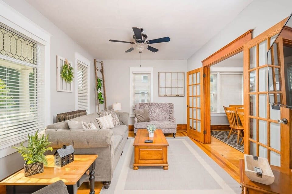 Spacious living room with plenty of seating and a 55" smart TV