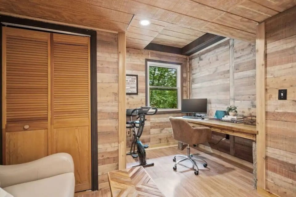 A home office in the 4th bedroom, complete with cycling equipment and yoga mats, if you need to get some work done