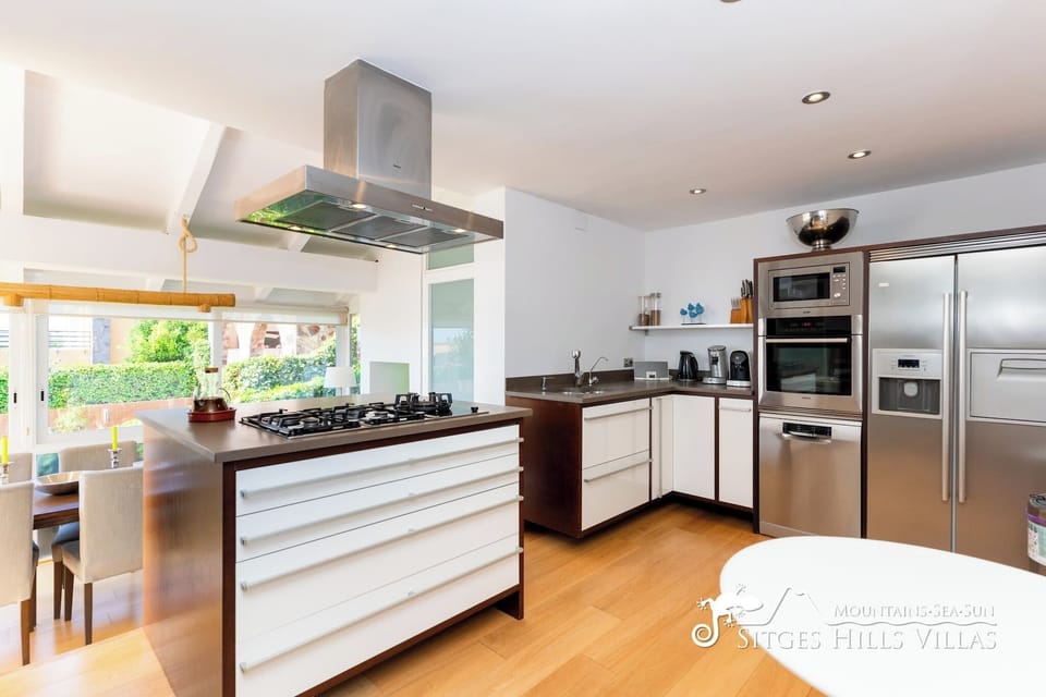 Fully equipped kitchen with top-of-the-line stainless steel appliances.