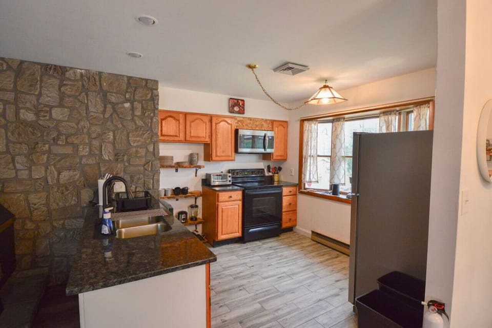 While cooking in the kitchen you are still able to hang out with everyone with our open concept living!