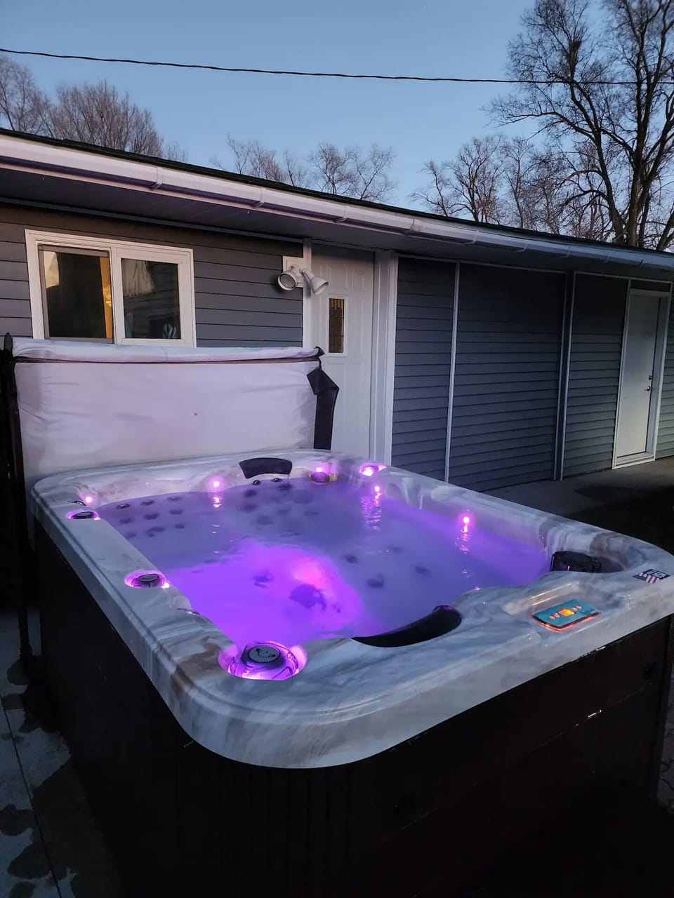 Relax and unwind in our 3 person hot tub