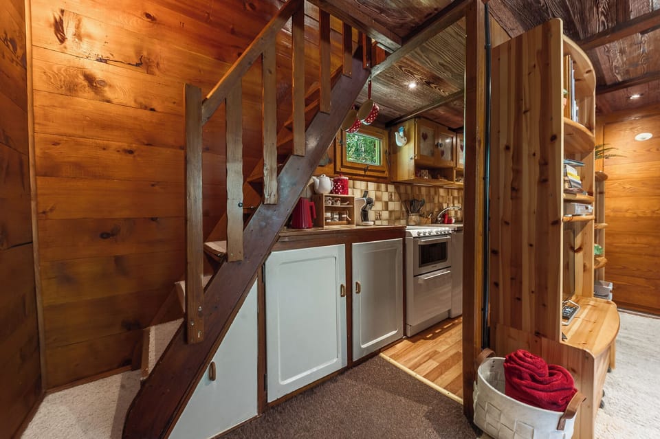 Stairs lead to the bedroom on the 1st floor.