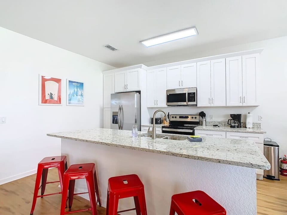 Open kitchen area with modern amenities, perfect for cooking and socializing.