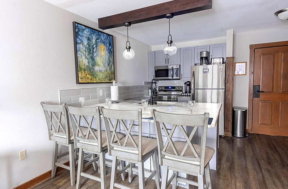 Beautifully stylish, modern kitchen island seats four and offers the perfect spot to gather and enjoy meals together!
