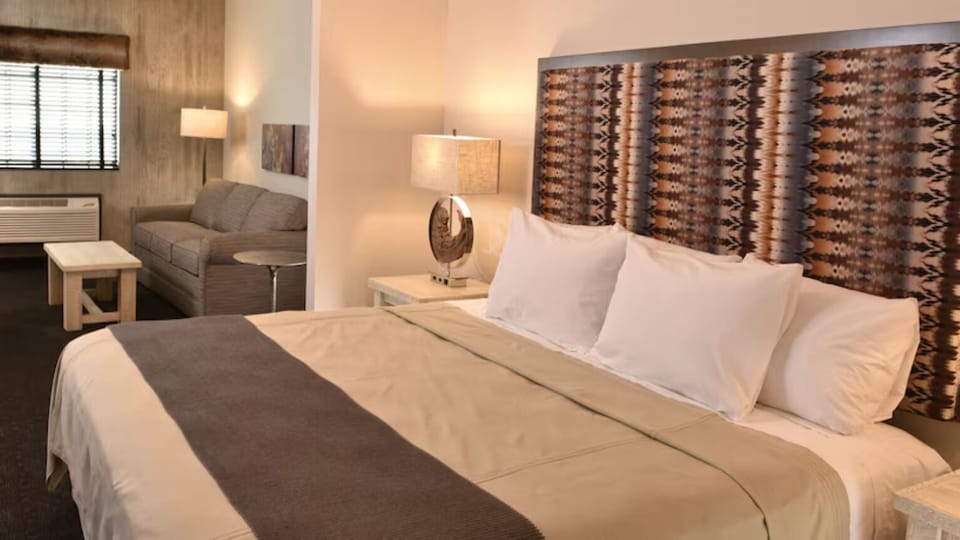 Sink into crisp pillows, then lounge on the sofa nearby.
