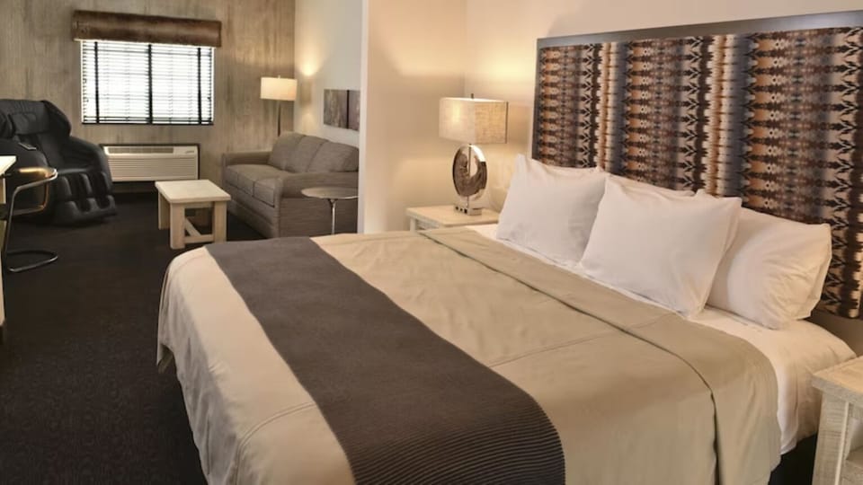 Unwind in crisp king-bed comfort with warm, soothing lighting.