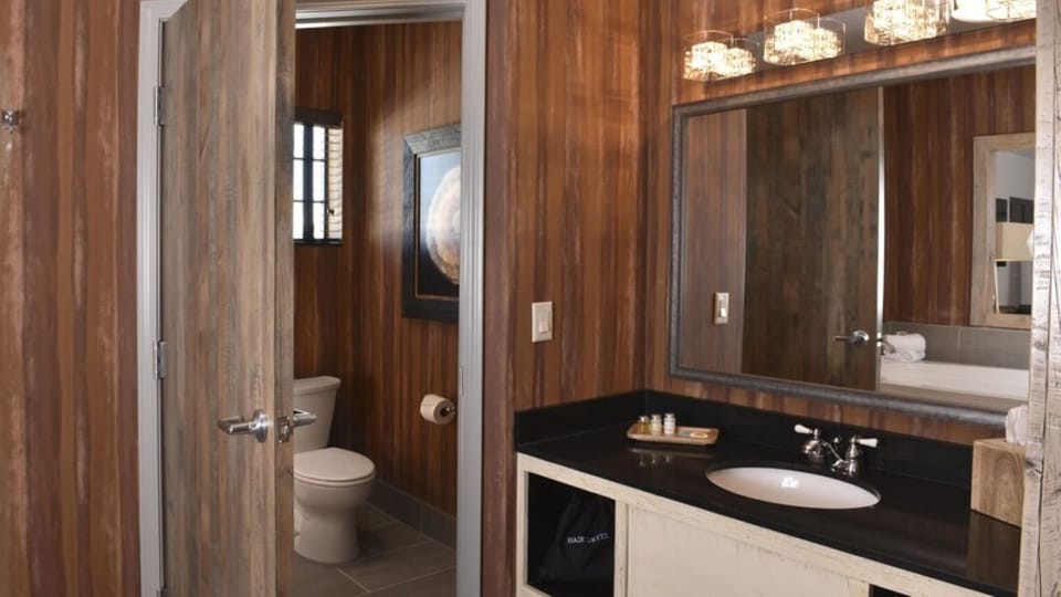 Refresh easily with a spacious vanity and bright mirror glow.