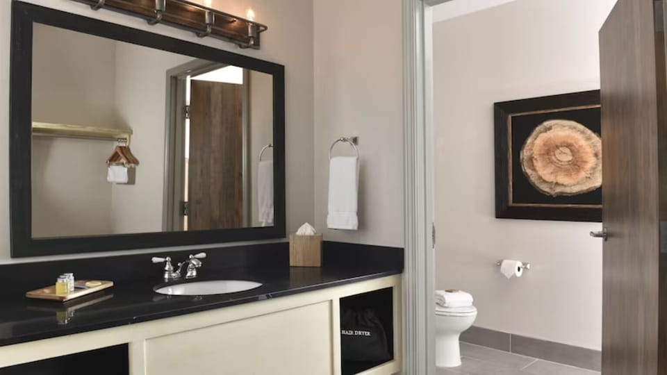 Refresh comfortably with a spacious vanity and bright, clean bath.