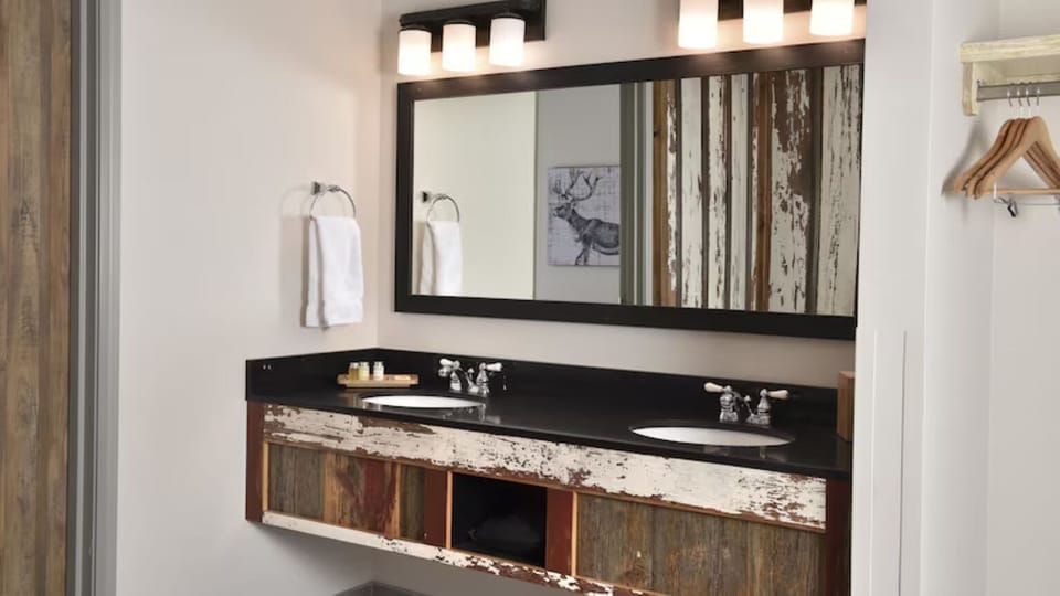 Get ready with bright lighting and a roomy double vanity.