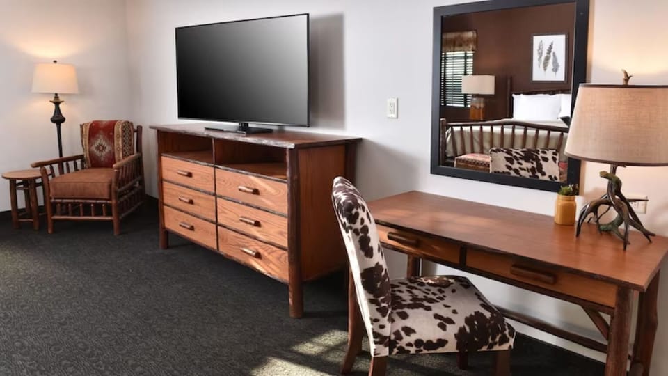 Settle in with big-screen entertainment and a dedicated work desk.