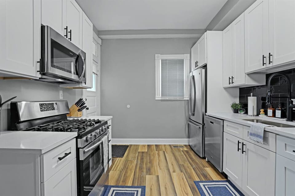 Cook up a storm in this stylish kitchen with sleek appliances and bright ambiance!