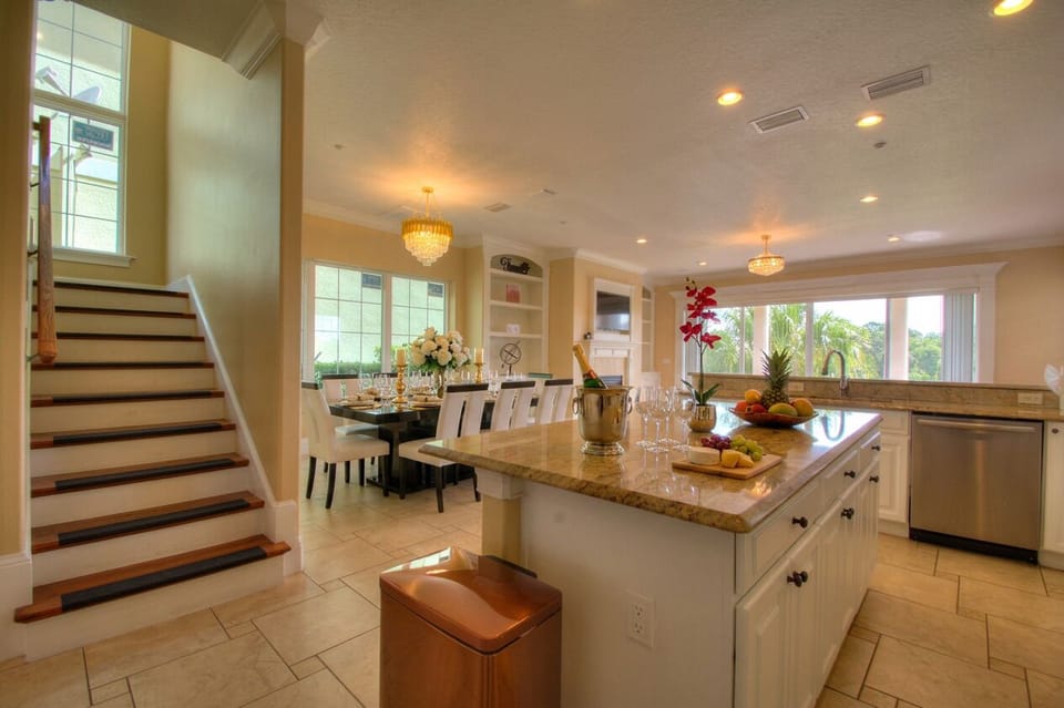 spacious kitchen opening to dining room and living room