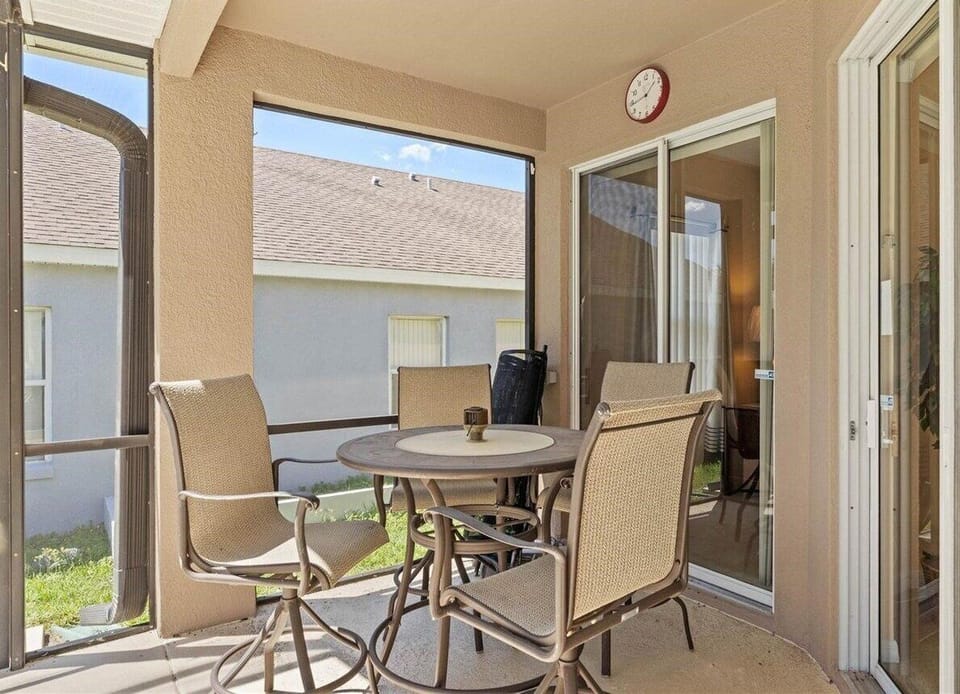 Enjoy meals, drinks, and conversation from the comfort of the screened patio