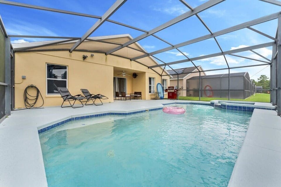This spacious, screened-in pool area offers plenty of room for sunbathing and family fun in a quiet, natural setting.