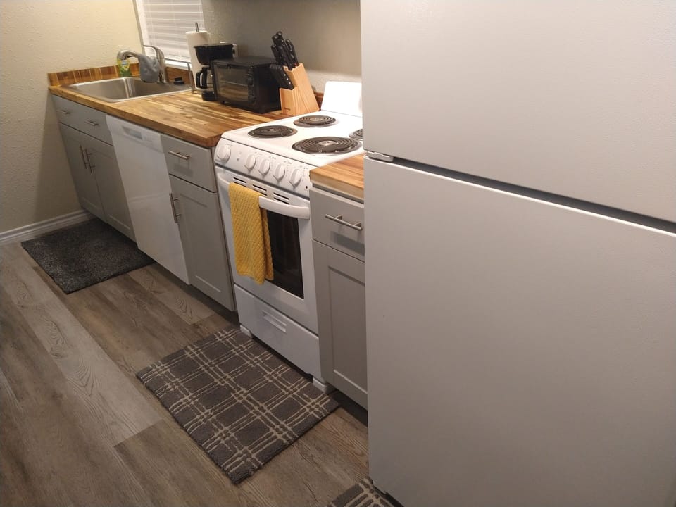 Beautiful Butcher Block Counters with Modern Luxury Vinyl Plank Flooring