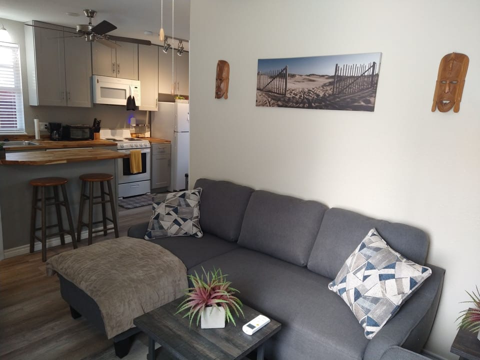 Open Floor-Plan with Ceiling Fans and Contemporary Art for Pleasant Decor