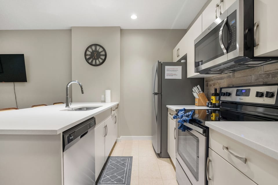 Fully equipped kitchen with modern appliances and ample counter space.