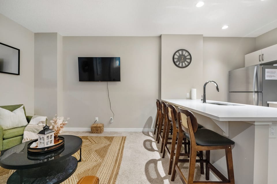 Open-concept living and dining area with Smart TV.