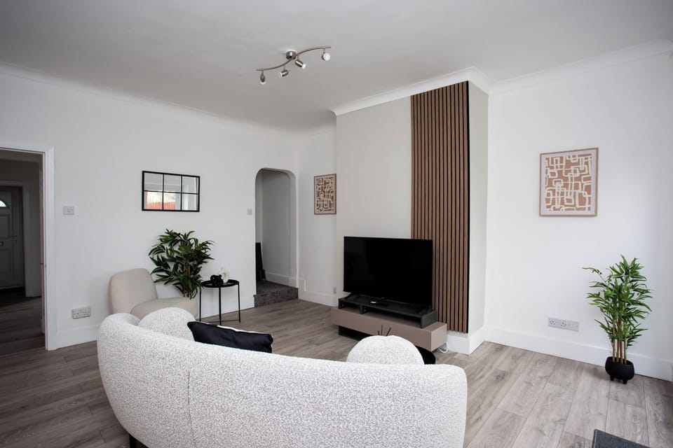 Sink into the plush sofa and lose yourself in a movie marathon or catch up on your favorite shows in style.