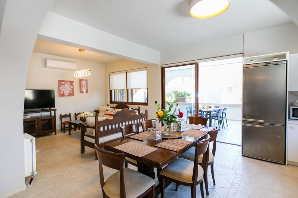 Dining area and living room with smart tv