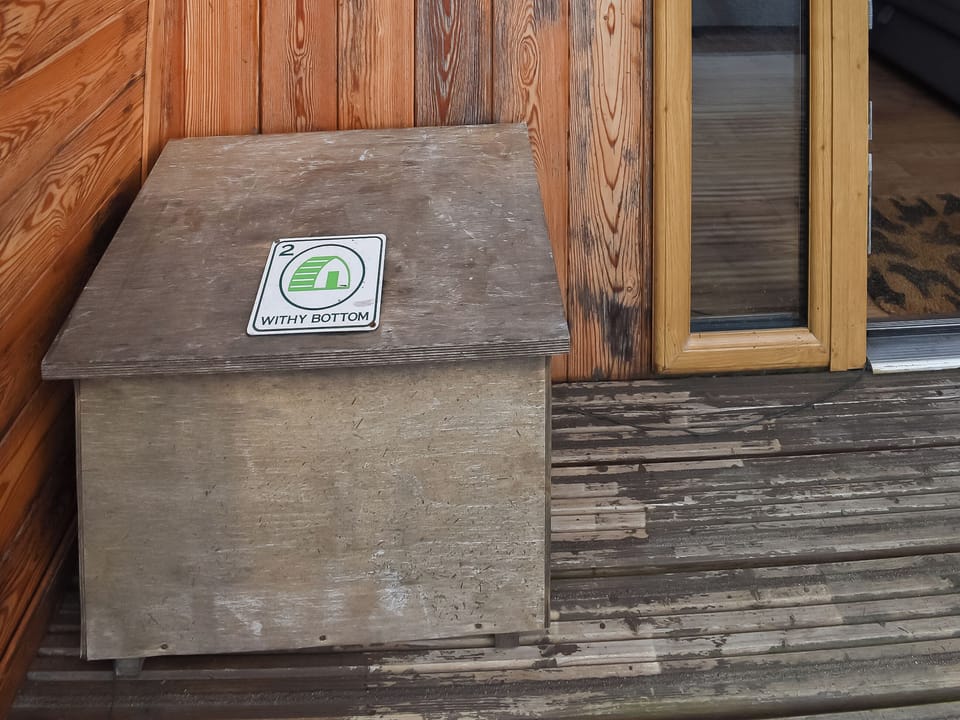 Decked terrace with outdoor furniture | Withy Bottom - Moorside Glamping Pods, Corney, near Millom
