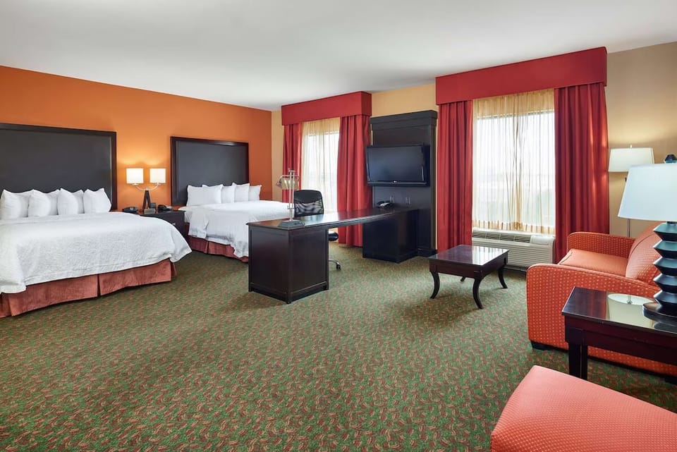 Relax in a spacious double-queen suite made for easy comfort.